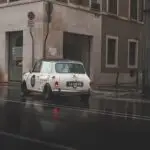 A Mini MK1 Rally Racing in the streets in Italy