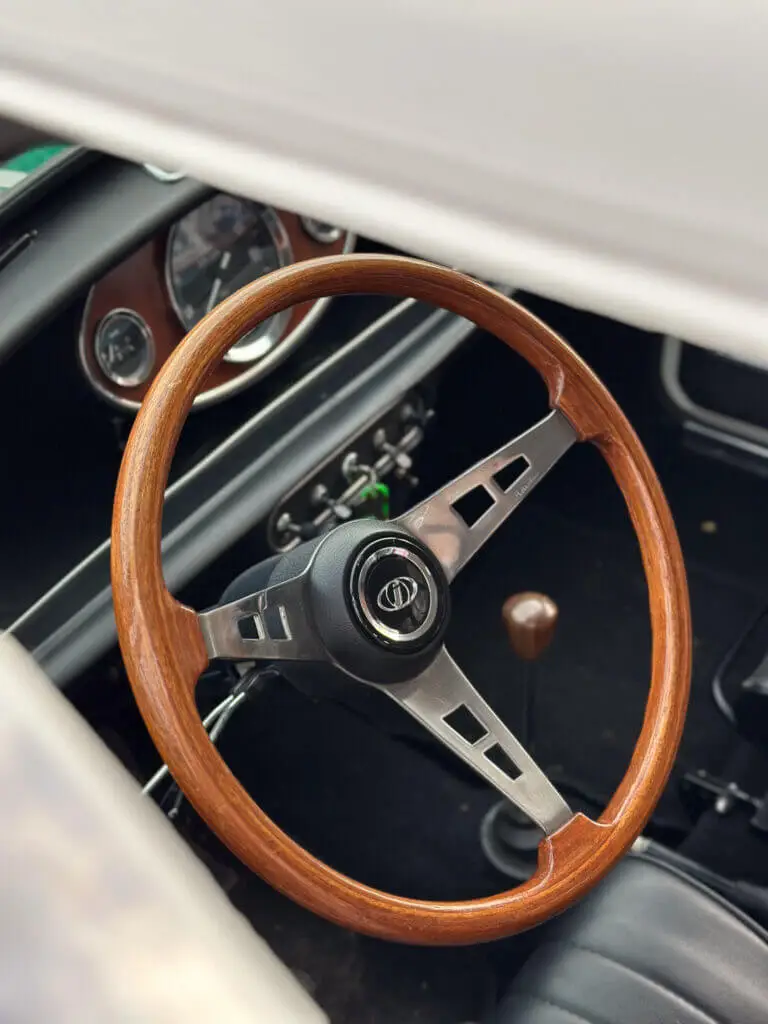 wooden steering wheel in a mini classic