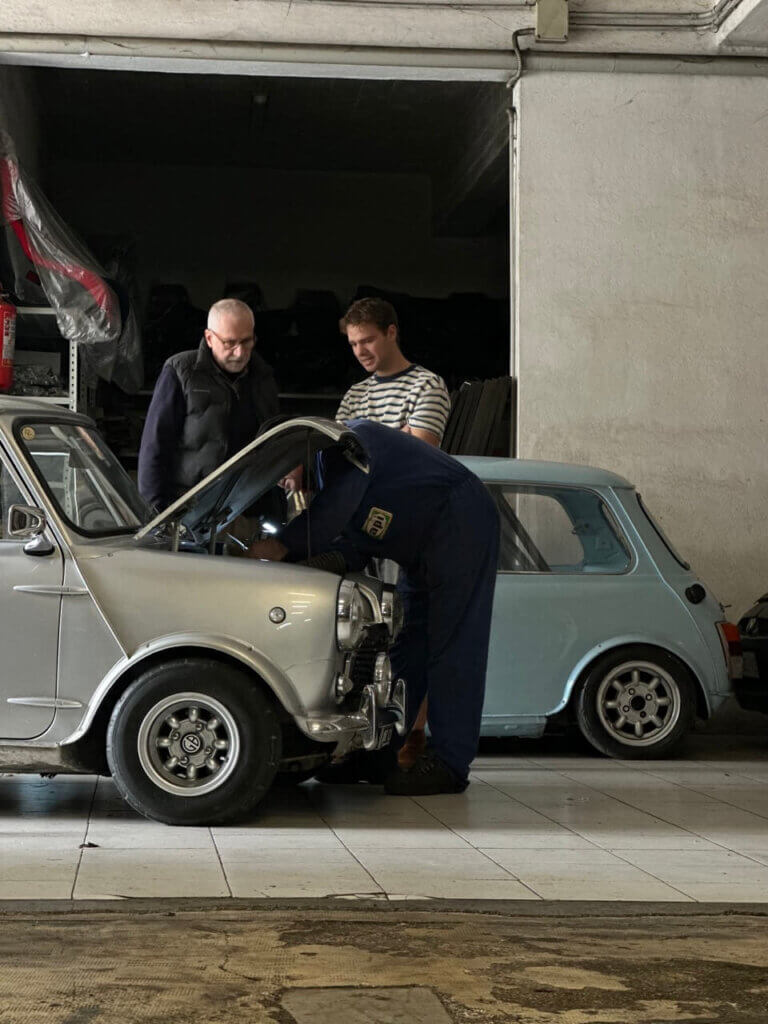 several man working on a mini classic
